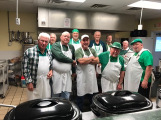 The St. Patrick’s Day kitchen crew had the task of preparing and serving the feast of corned beef, cabbage, potatoes, and jumbo carrots along with green - mint chocolate chip ice cream and Irish Coffee.  From left to right are: Joe Nance, Dave Gibbons; Chaz Rowe, Wayne Spears, Bill Gajewski, Jim Bicknell, Jim Stueve, Bob Stocklin and Tommy Lynn all dressed for the day.